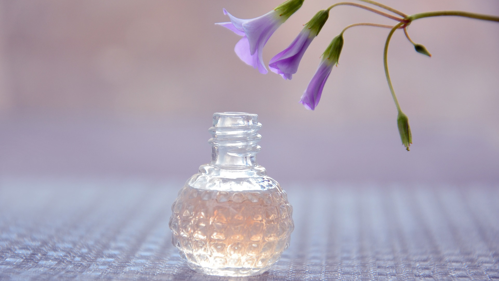 Essentials oil blend in bottle with flower